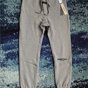 Fear of God Essentials men’s dark oatmeal pants